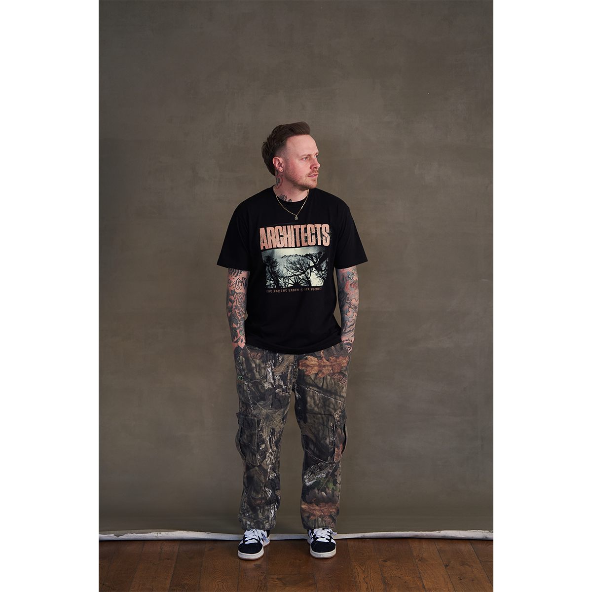 Black short-sleeve unisex regular fit t-shirt with Architects tree print across the front