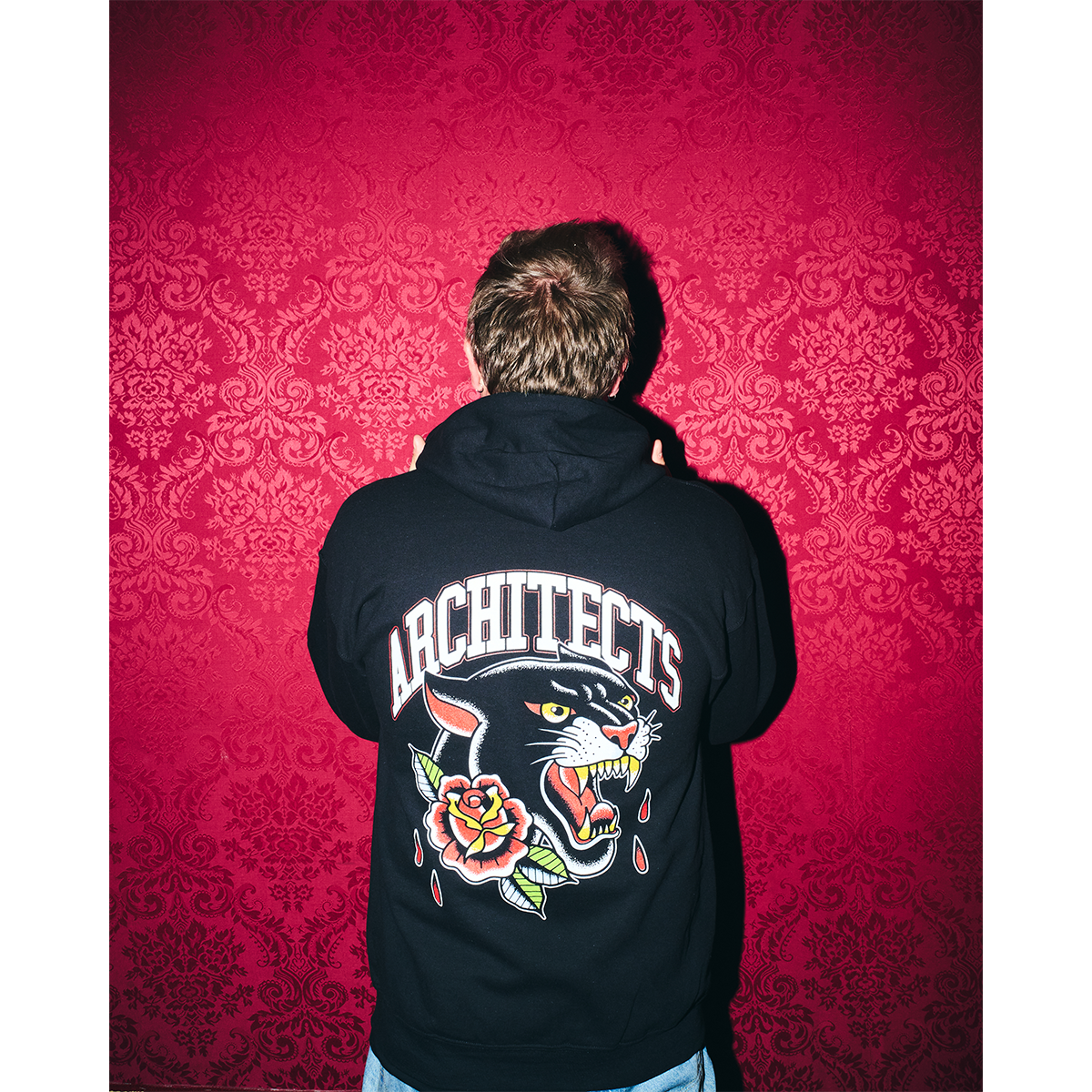 Black unisex zip-up hoodie with Architects Floral Panther print across the back