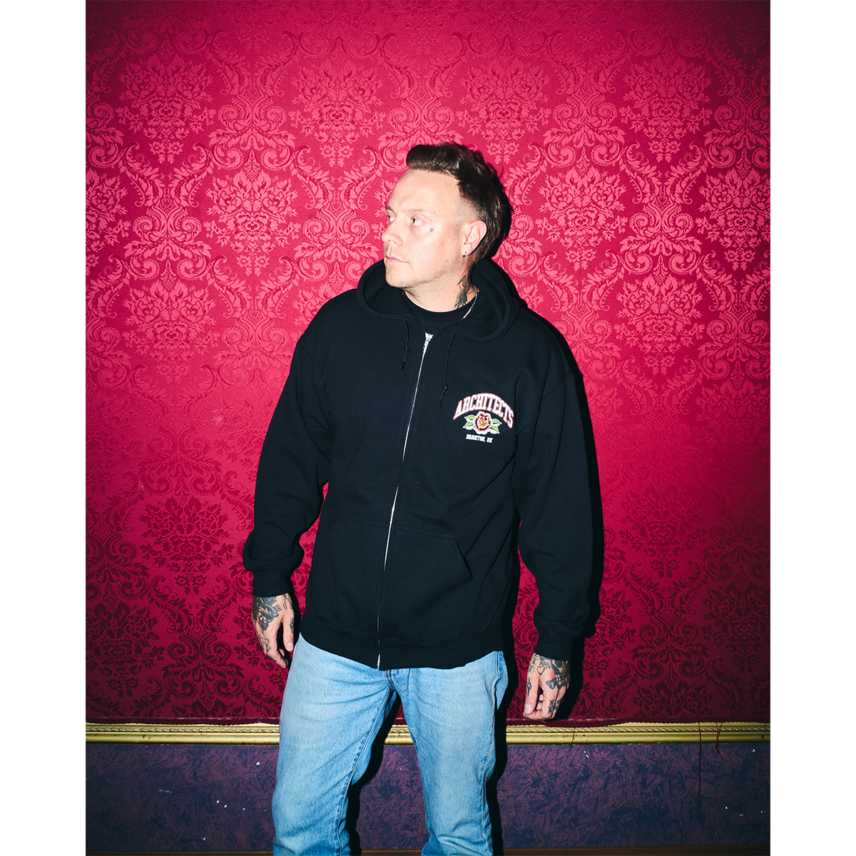 Black unisex zip-up hoodie with Architects Floral Panther print on the front right chest.