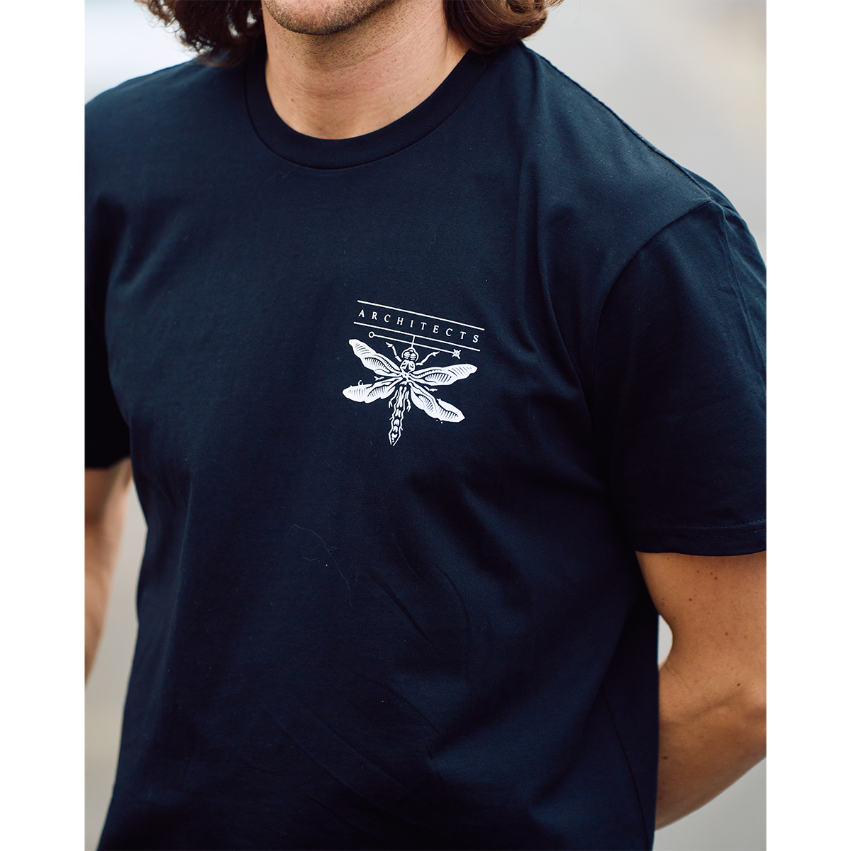 Black short-sleeve unisex t-shirt with Architects Specimen print across the back