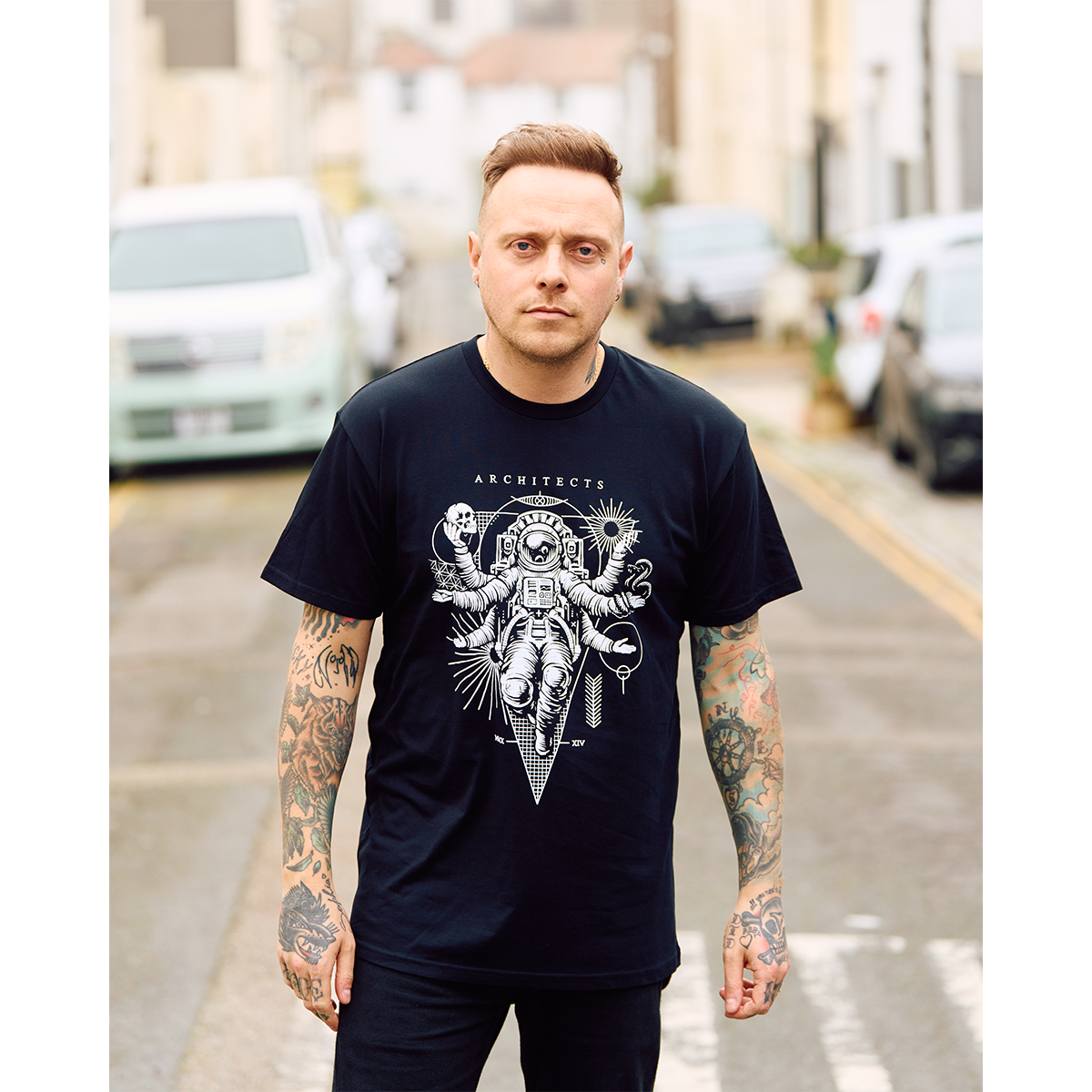 Black Short-sleeve unisex T-Shirt with Architects Astronaut print across the front
