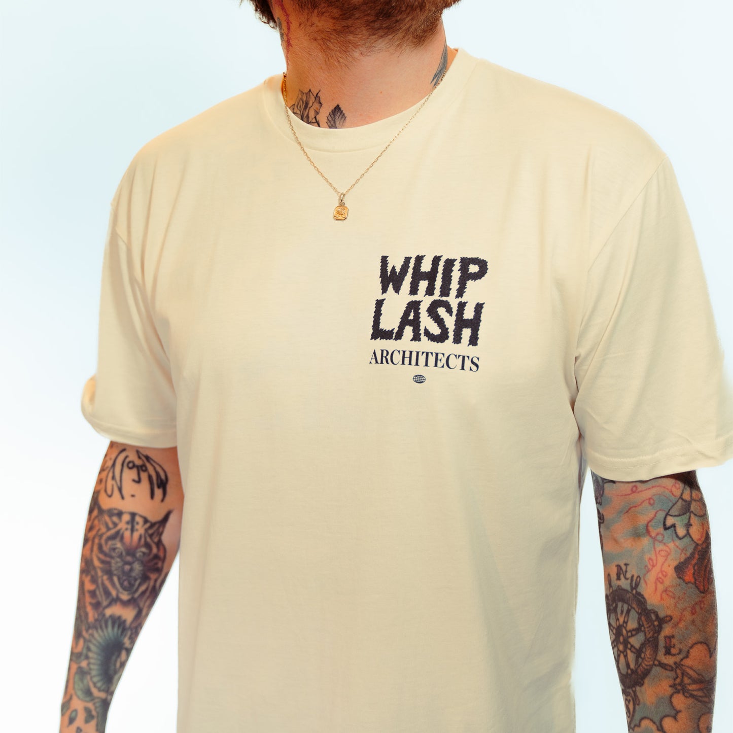 Ecru unisex short-sleeve T-Shirt featuring an Architects "Whiplash" print on the front right chest.