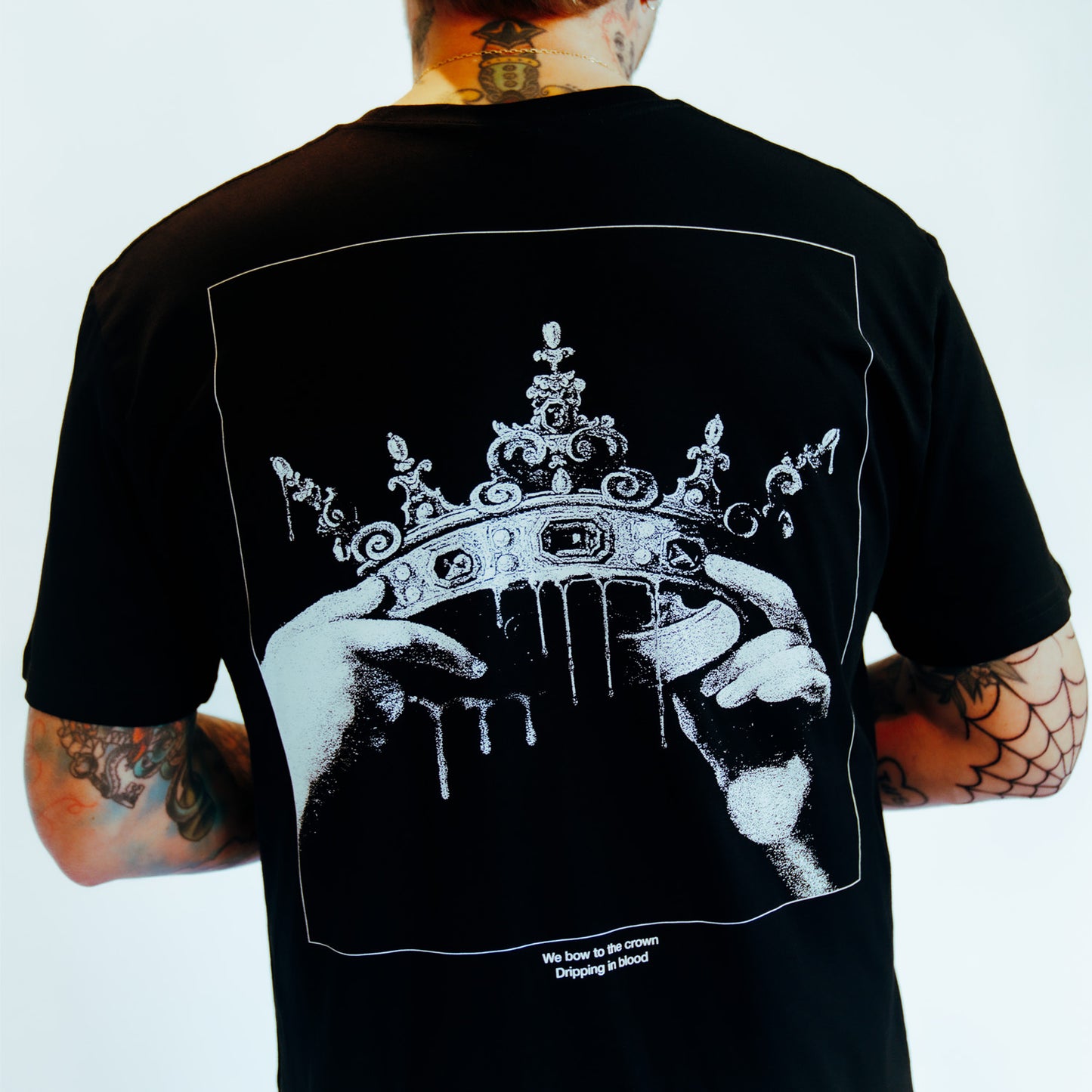 Black unisex short-sleeve T-Shirt with grey Architects crown print across the back