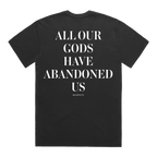 Back view of a relaxed dark vintage gray short-sleeve T-shirt featuring white text across the back reading ‘All our Gods have abandoned us,’ with smaller ‘Architects’ text underneath.