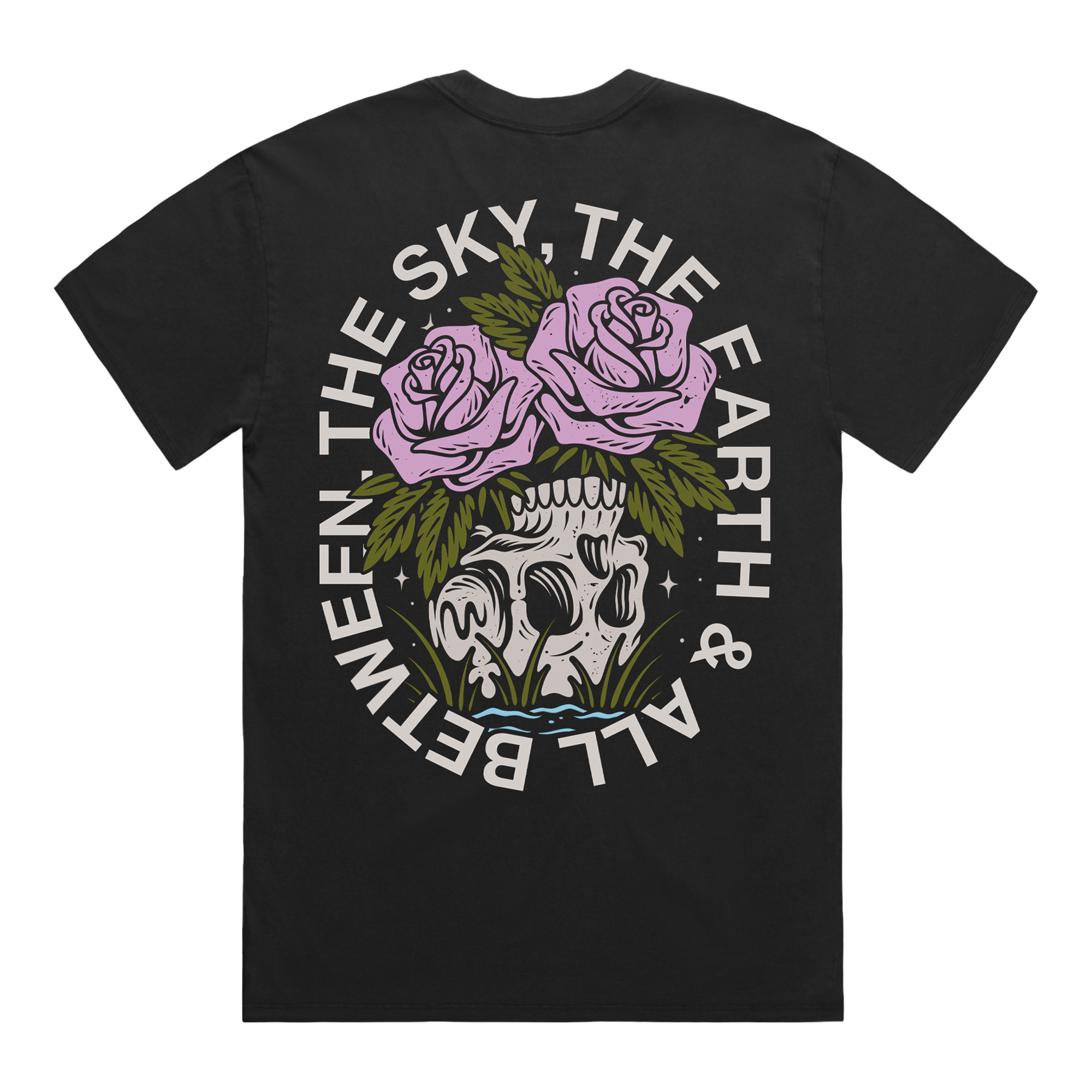 Back of a black short-sleeve t-shirt featuring a flower–skull graphic, with white text around it that reads “The Sky, The Earth & All Between.”