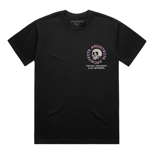 Black short-sleeve t-shirt with a skull graphic on the right side of the chest, surrounded by pink “Architects” text, and white text underneath that reads “The Sky, The Earth & All Between.”