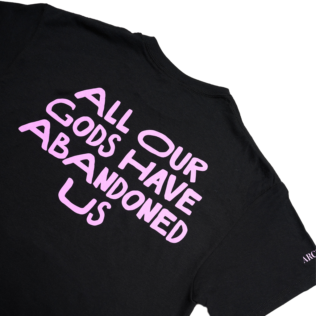 Black Unisex short-sleeve t-shirt with pink Architects "All Our God Have Abandoned Us" skull text across the back