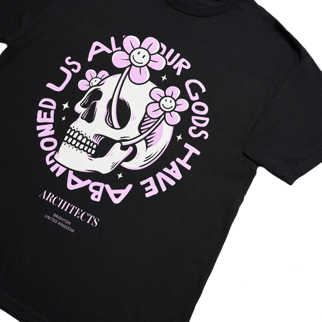Black Children's short-sleeve t-shirt with pink Architects "All Our God Have Abandoned Us" skull print across the front