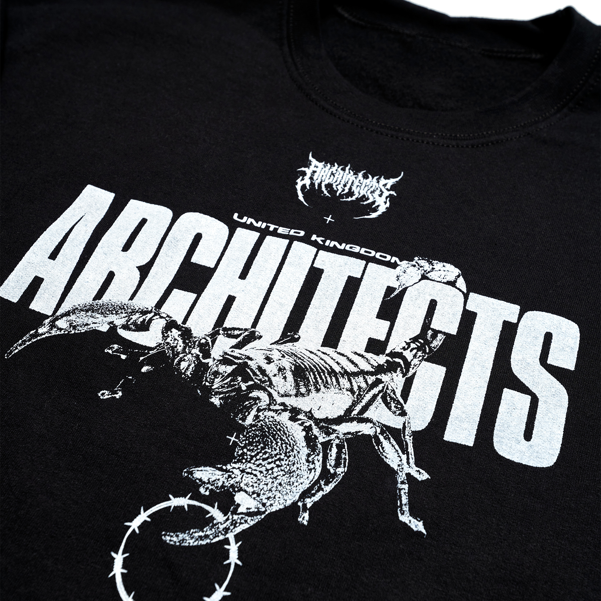 Black unisex crewneck featuring a white Architects Scorpio print across the front and a barbed wire print across the sleeves.