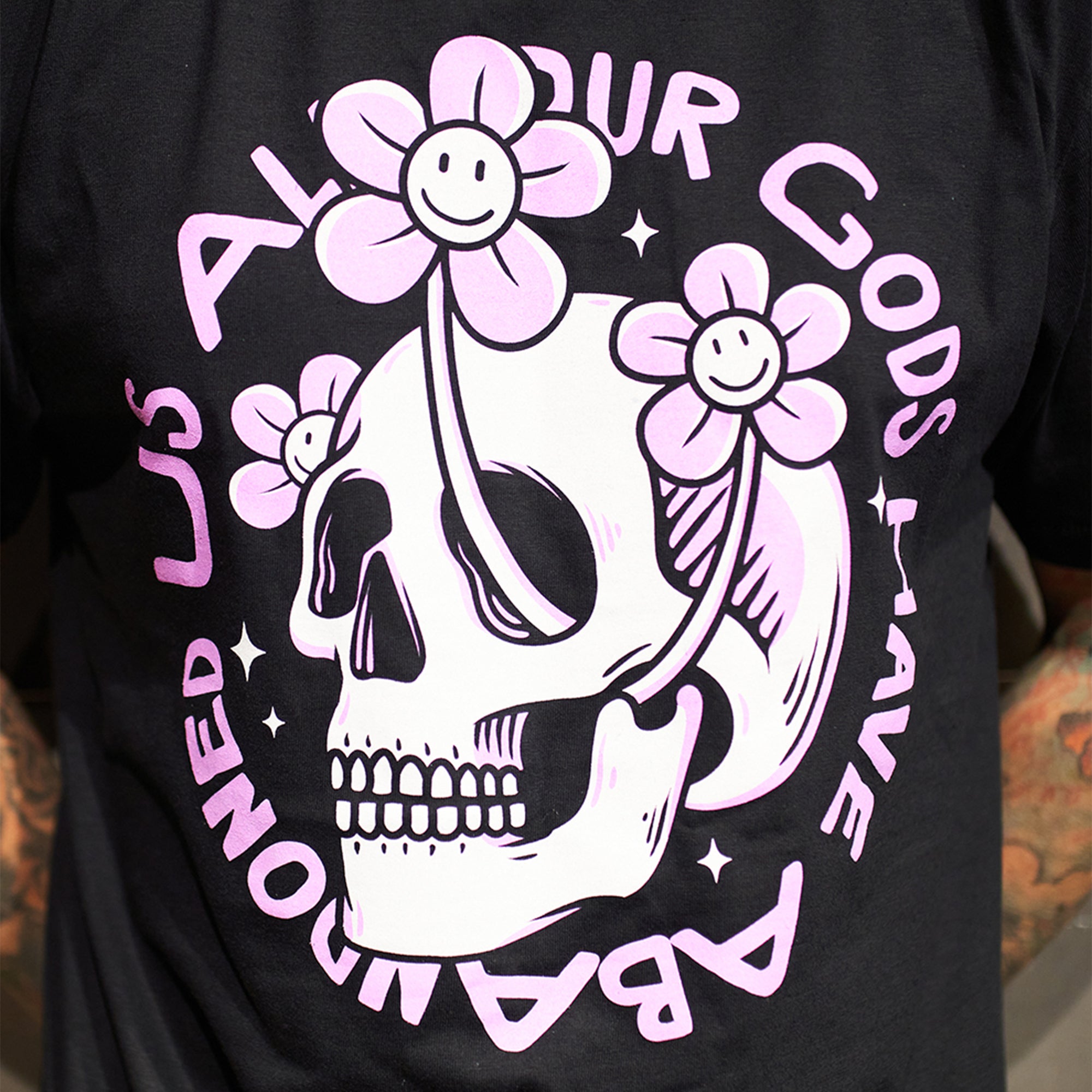 Black Children's short-sleeve t-shirt with pink Architects "All Our God Have Abandoned Us" skull print across the front