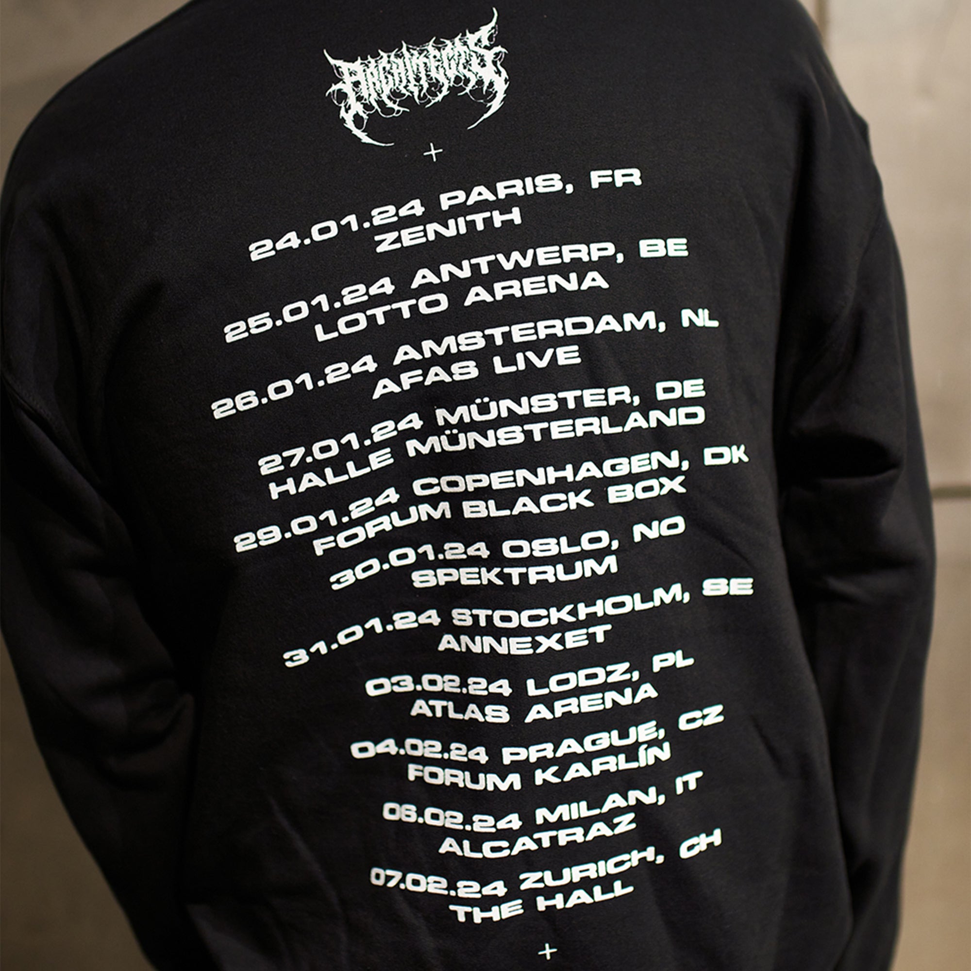 Black unisex crewneck featuring UK Winter 2024 tour dates across the back and a barbed wire print across the sleeves.