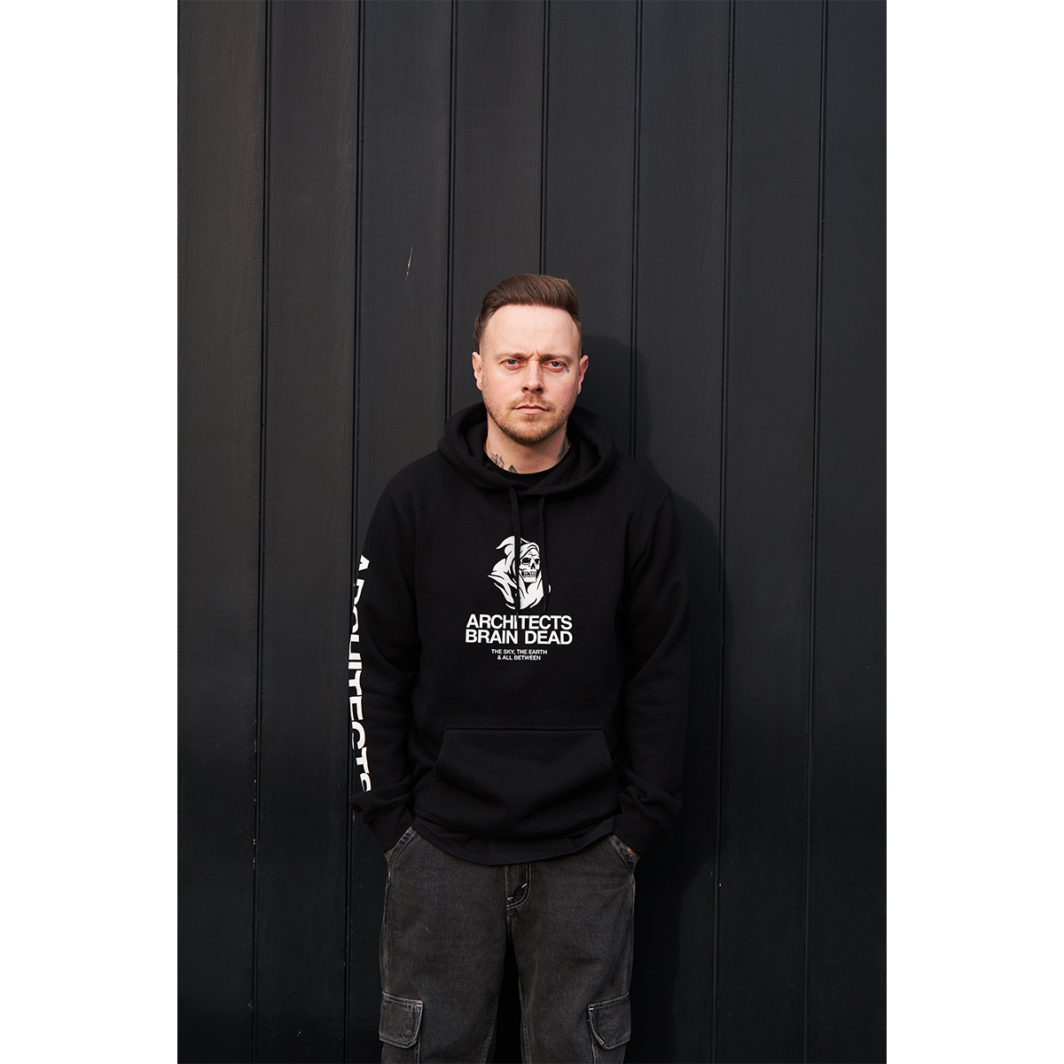 Black unisex drawstring hoodie with Architects Brain Dead print across the front, and Architects text print along the right sleeve.