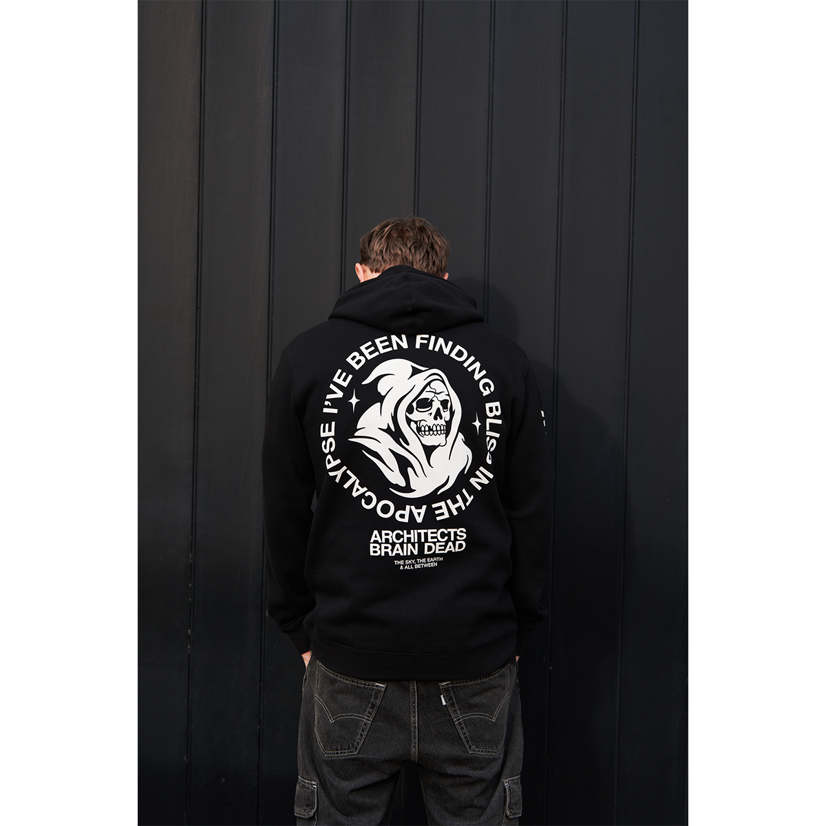 Black unisex drawstring hoodie with Architects Brain Dead print across the back, and Architects text print along the right sleeve.