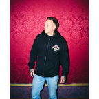 Black unisex zip-up hoodie with Architects Floral Panther print on the front right chest. 