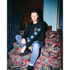 Black unisex long-sleeve T-shirt featuring a pink 'Are You Happy Now' print on the chest, with white and blue Architects prints along the sleeves.