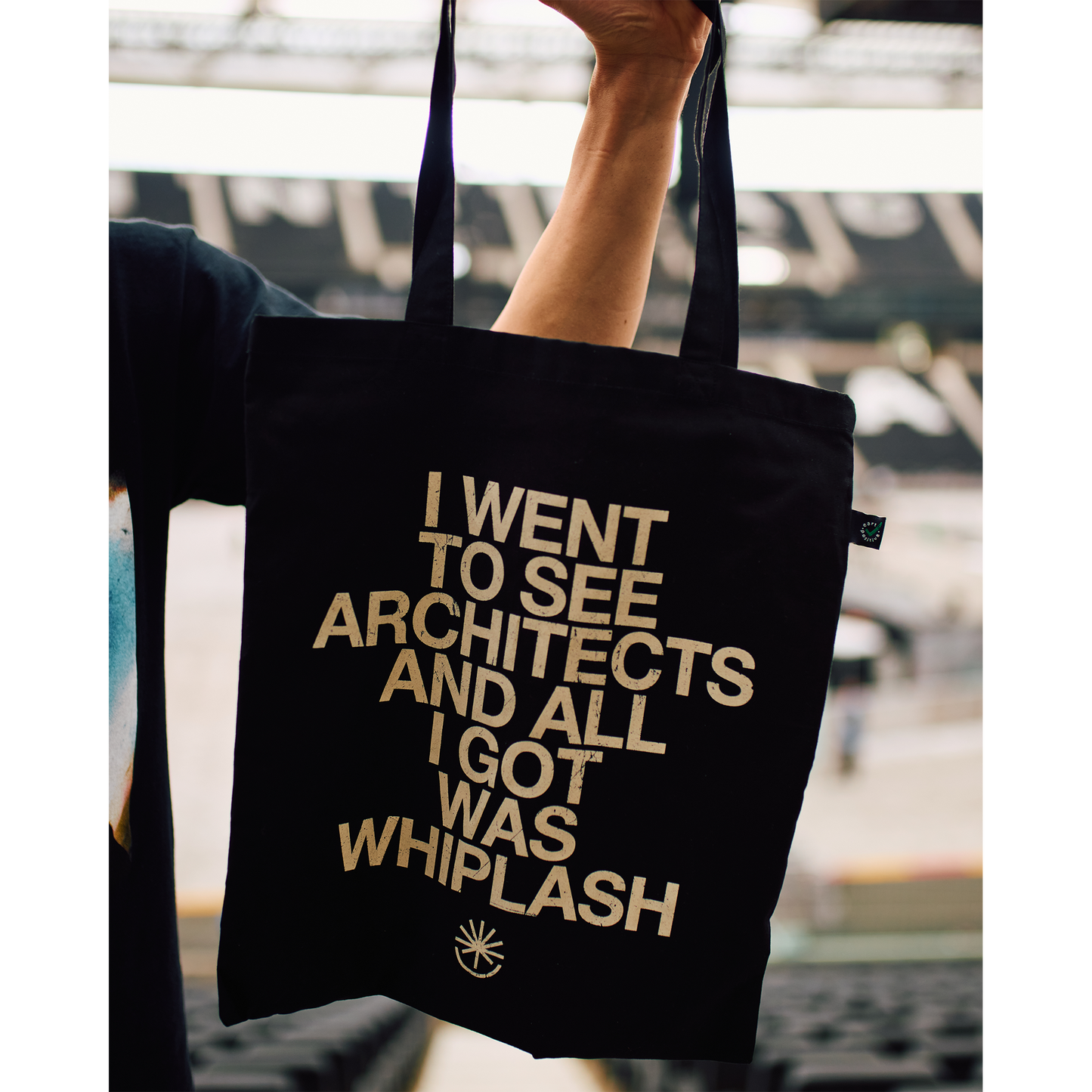 Black Tote bag with white text reading 'I went to see Architects and all I got was Whiplash'