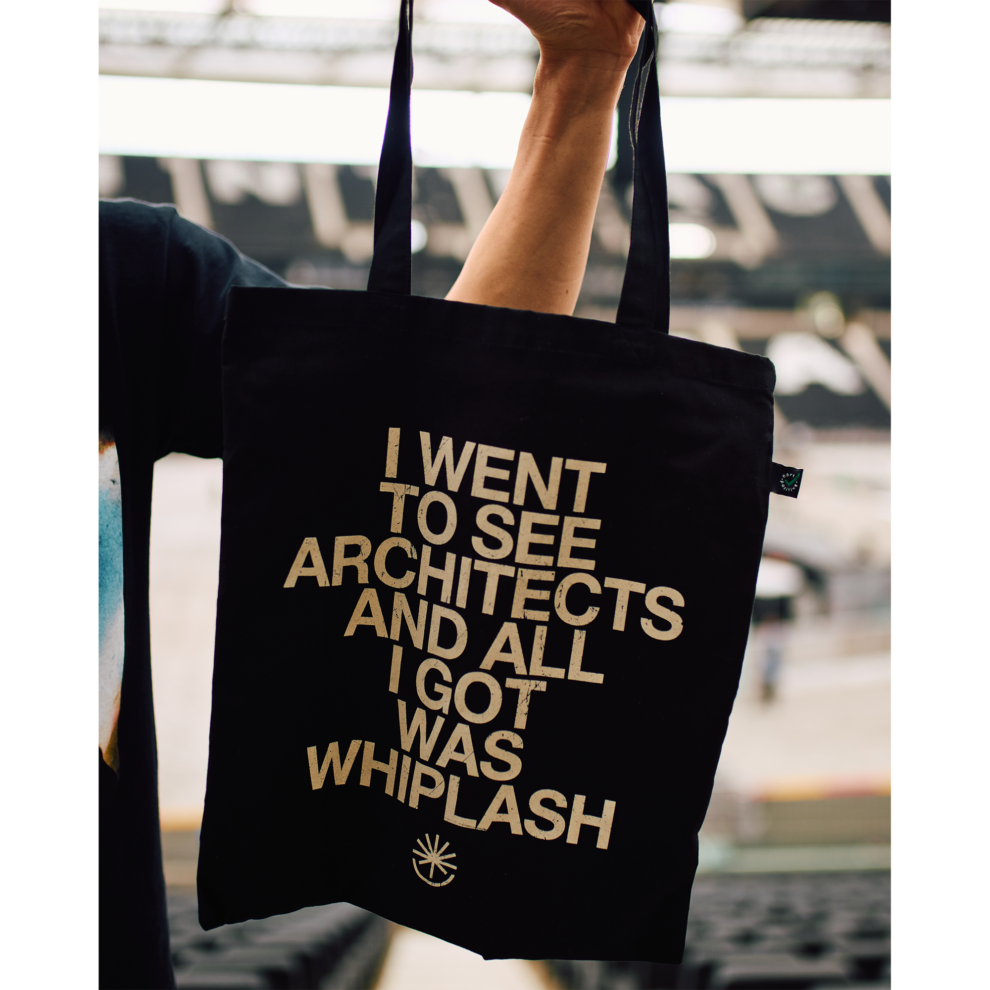 Black Tote bag with white text reading 'I went to see Architects and all I got was Whiplash'