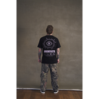 Black short-sleeve unisex regular fit T-shirt with pink Architects eye print across the back