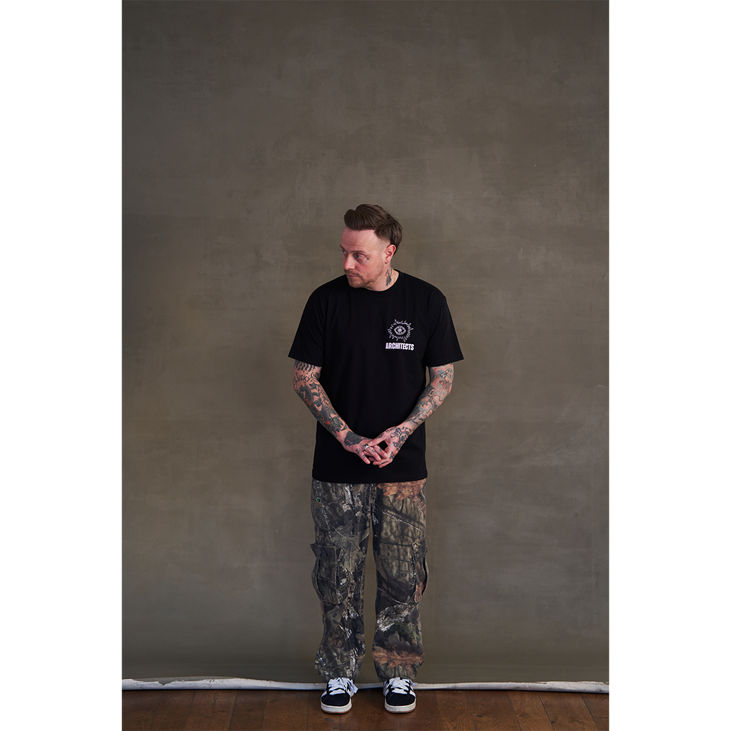 Black short-sleeve unisex regular fit T-shirt with round pink Architects eye print on the front chest