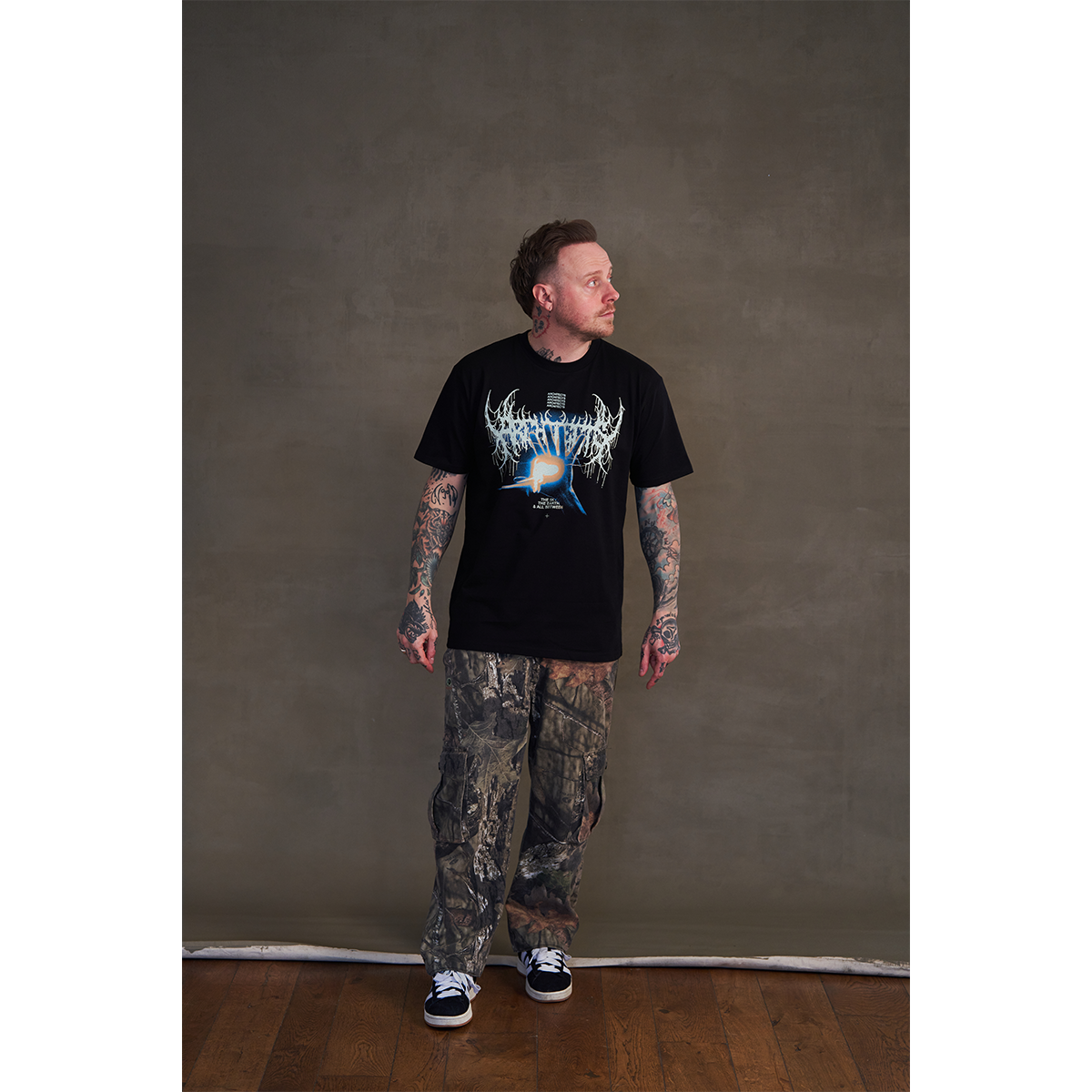 Black short-sleeve unisex regular fit T-shirt featuring the Architects Glow print across the front.