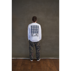 White long-sleeve unisex regular fit T-shirt with Architects Blackhole eye print across the back, Architects text along the right sleeve, and eye print along the left sleeve.