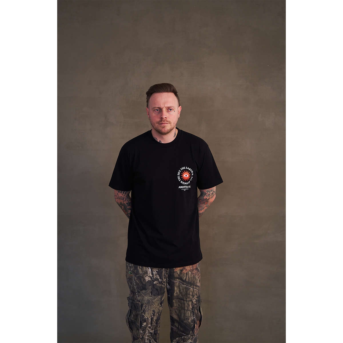 Black short-sleeve unisex regular fit T-shirt featuring Architects The Sky, The Earth & All Between print on the front right chest and across the back.