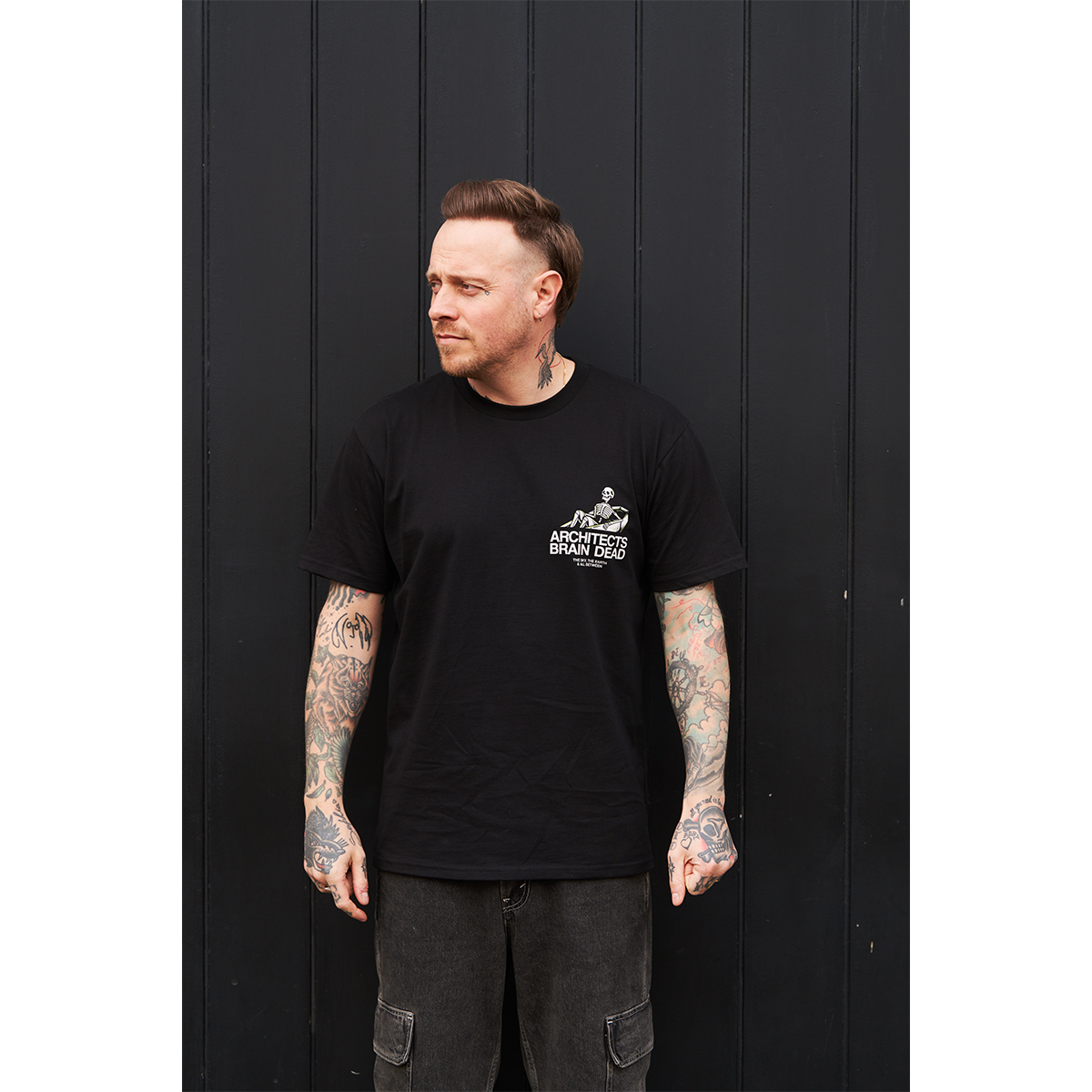 Black short-sleeve regular fit T-shirt with Architects Brain Dead print on the front right chest.