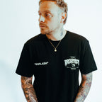 Black unisex short-sleeve T-Shirt with white Architects Whiplash text print across the front chest